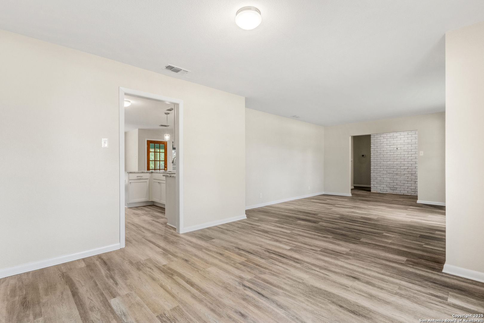 6041 Trone Trail Leon Valley, TX 78238 - Photo 6 of 30 a view of empty room with wooden floor