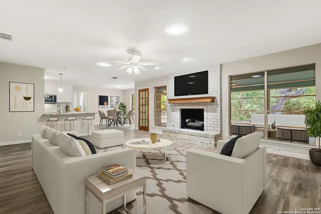 a living room with furniture fireplace and a flat screen tv