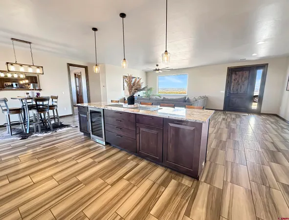 a kitchen with stainless steel appliances granite countertop a sink a stove and cabinets