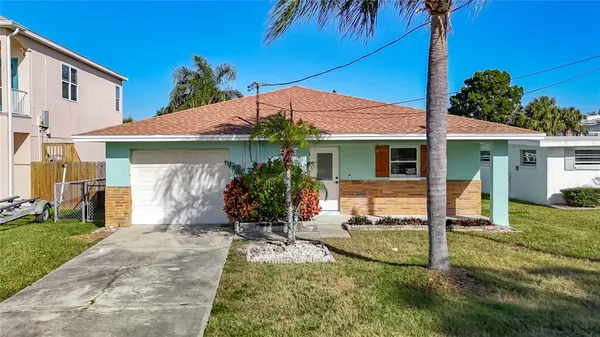 a view of a house with a yard and plants