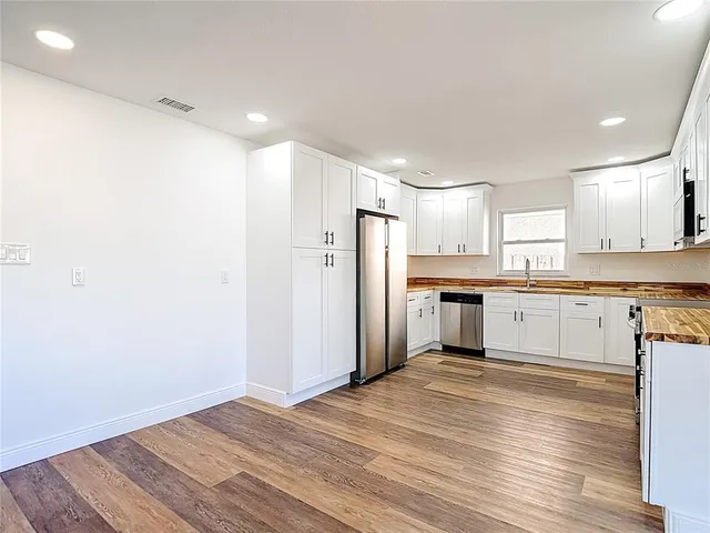 a view of kitchen with wooden floor