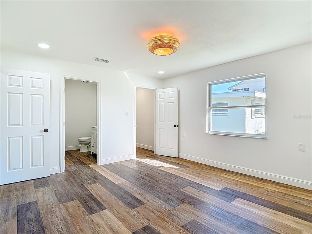 7027 McCray Drive Hudson, FL 34667 - Photo 19 of 33 a view of an empty room and wooden floor