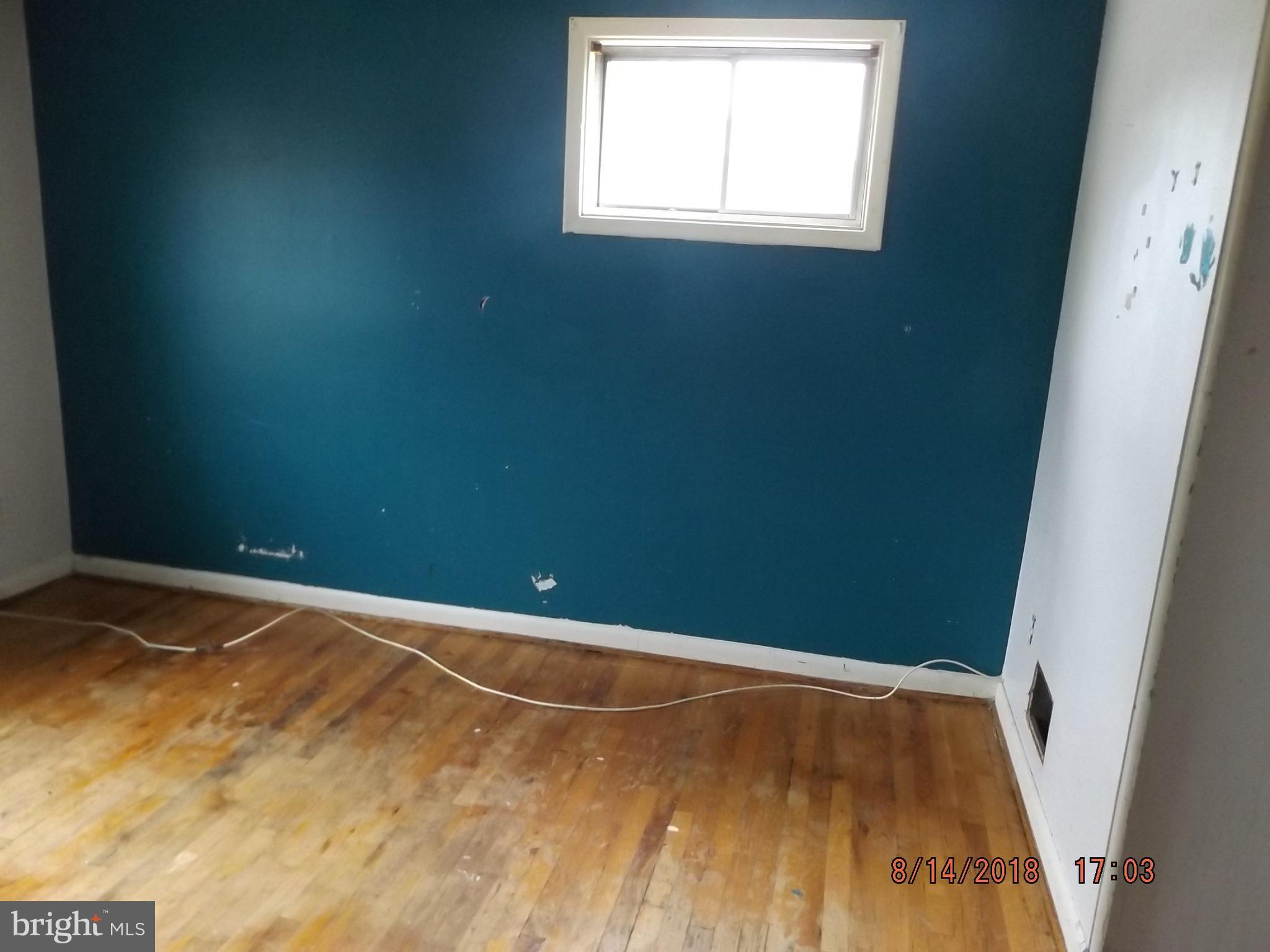 1635 Riverwood Road Baltimore, MD 21221 - Photo 13 of 30 a view of a room with wooden floor and window