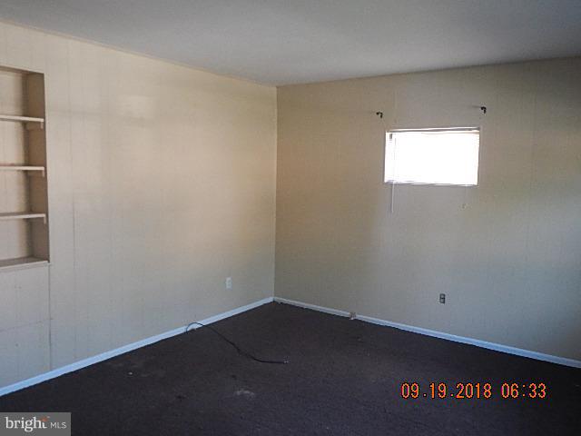 1635 Riverwood Road Baltimore, MD 21221 - Photo 14 of 30 an empty room with a empty space and window