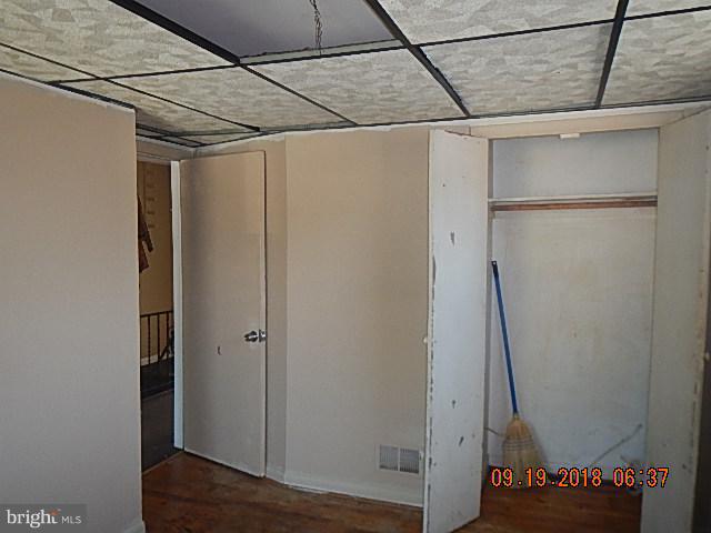 1635 Riverwood Road Baltimore, MD 21221 - Photo 18 of 30 a view of a room with wooden floor and cabinet