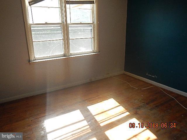 1635 Riverwood Road Baltimore, MD 21221 - Photo 22 of 30 a view of an empty room and window