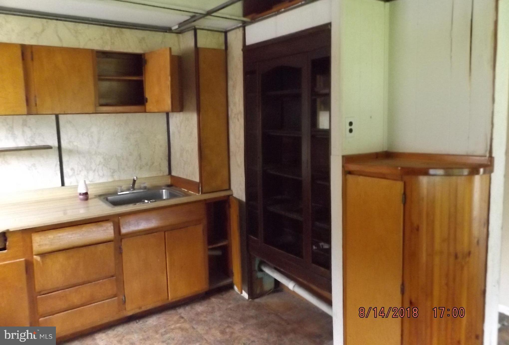 1635 Riverwood Road Baltimore, MD 21221 - Photo 24 of 30 a bathroom with a sink and a mirror