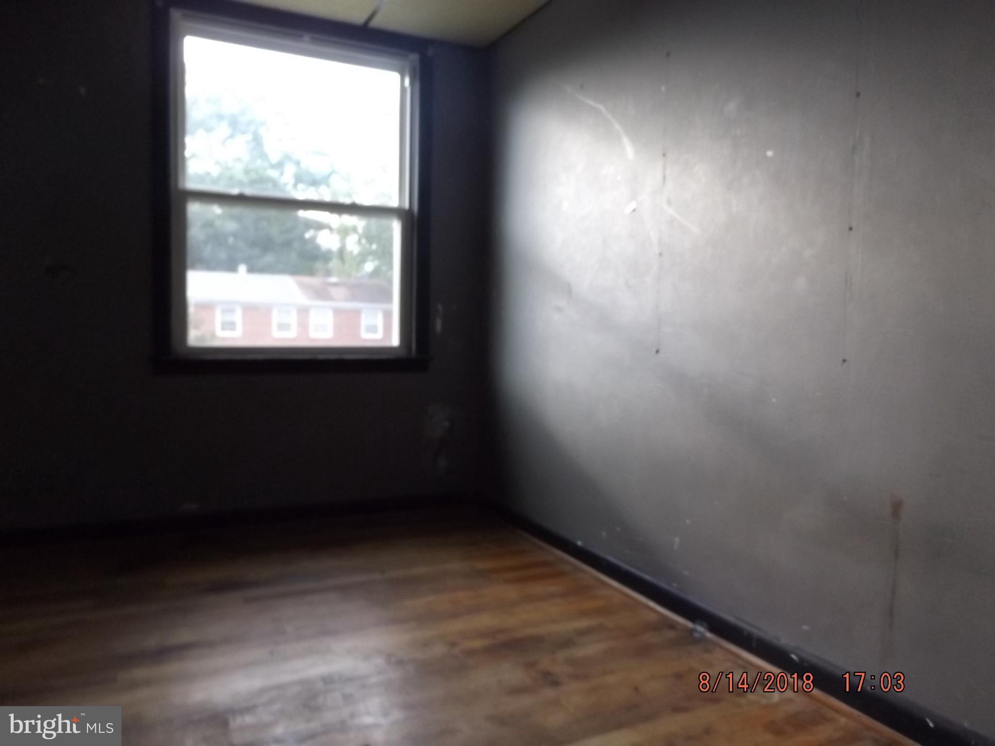 1635 Riverwood Road Baltimore, MD 21221 - Photo 28 of 30 an empty room with a window