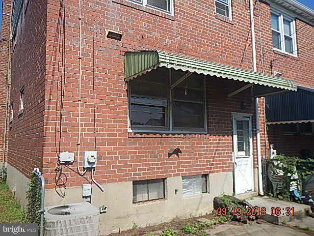 1635 Riverwood Road Baltimore, MD 21221 - Photo 4 of 30 a front view of a house with a garden