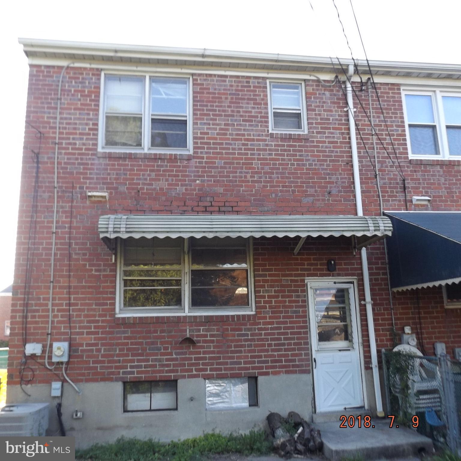 1635 Riverwood Road Baltimore, MD 21221 - Photo 5 of 30 a building view with a brick wall