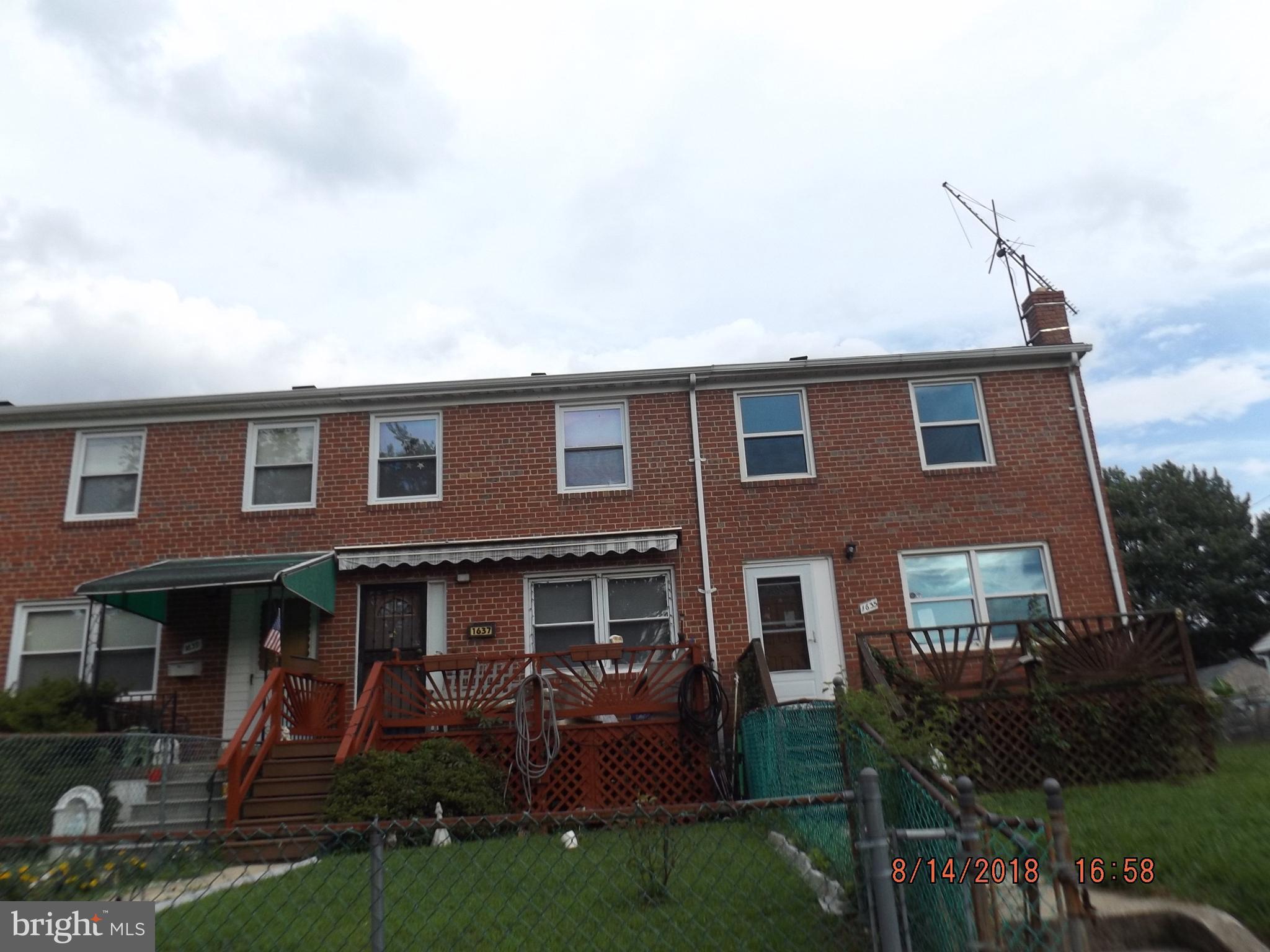 1635 Riverwood Road Baltimore, MD 21221 - Photo 6 of 30 a front view of a house with a yard