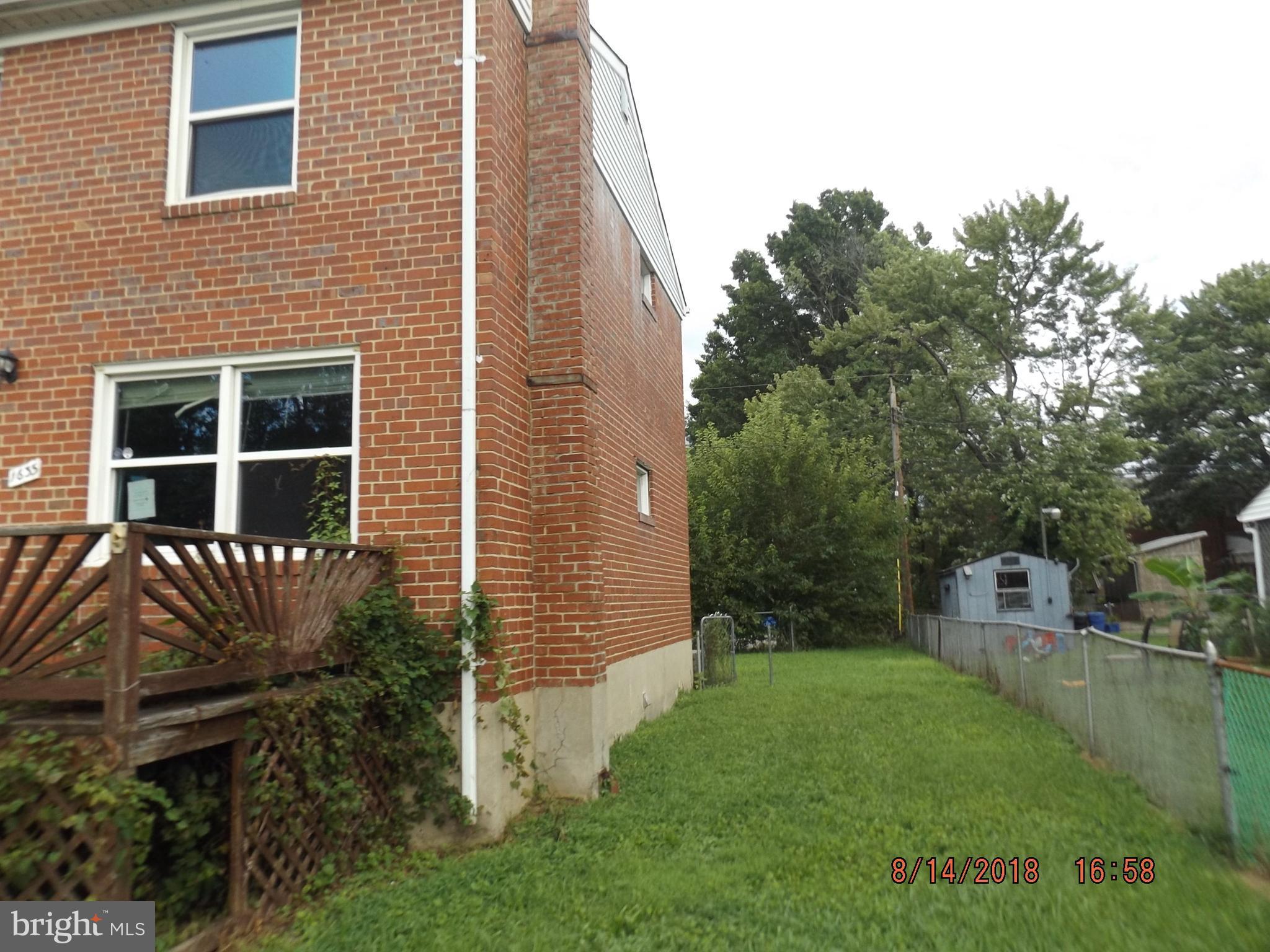1635 Riverwood Road Baltimore, MD 21221 - Photo 7 of 30 a backyard of a house with lots of green space
