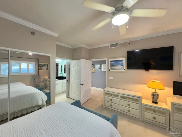 a living room with furniture and large windows