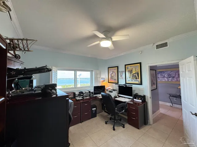 a living room with furniture a window and a flat screen tv