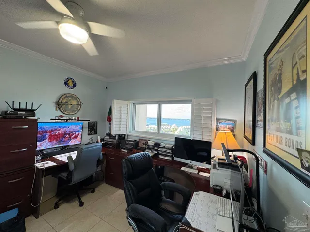 a room with furniture a flat screen tv and a large window