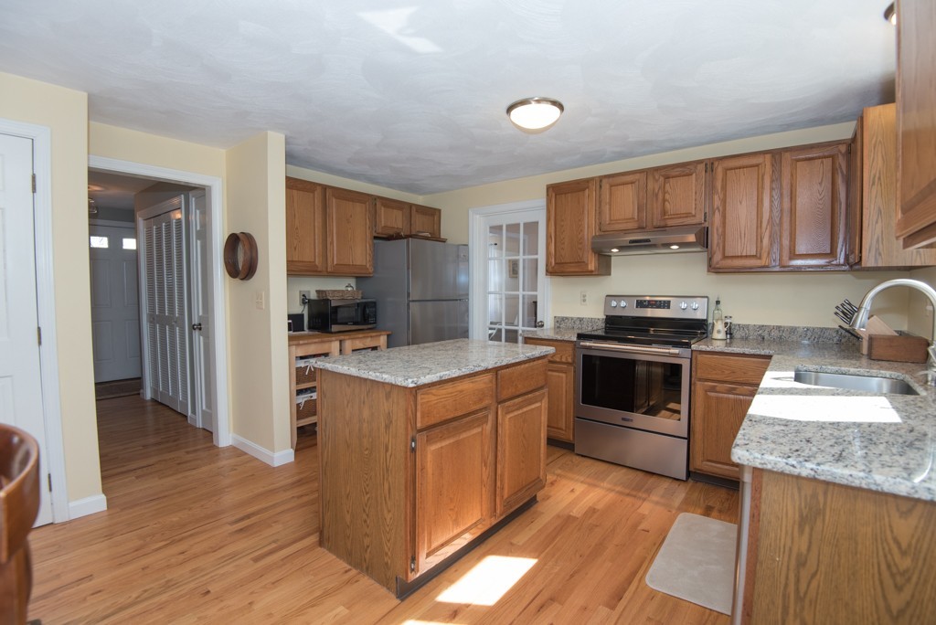 35 Acorn Road Northbridge, MA 01588 - Photo 3 of 23 a kitchen with a stove a sink and a refrigerator
