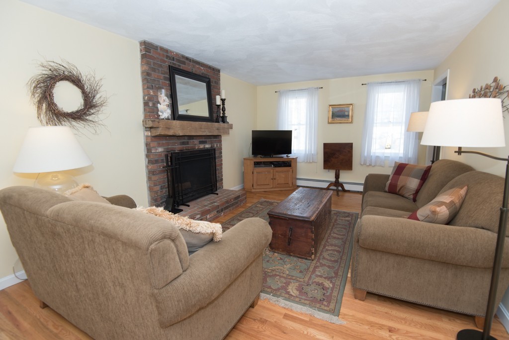 35 Acorn Road Northbridge, MA 01588 - Photo 7 of 23 a living room with furniture a fireplace and a flat screen tv