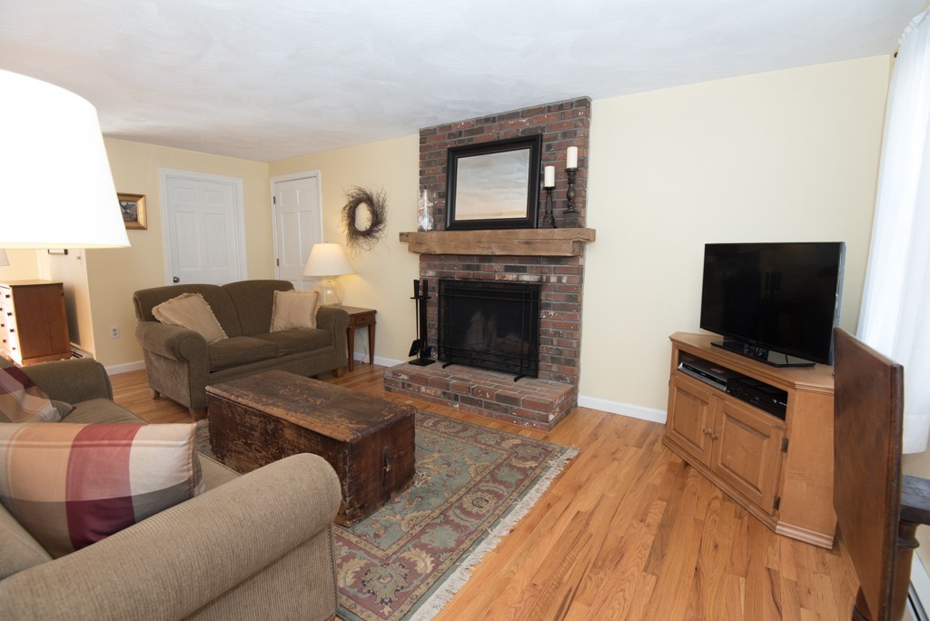 35 Acorn Road Northbridge, MA 01588 - Photo 8 of 23 a living room with furniture and a flat screen tv