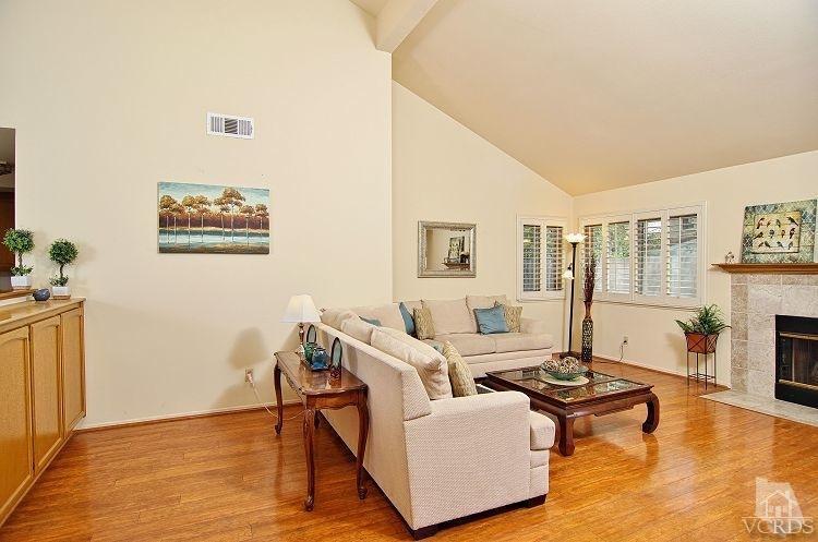 2921 Fanshell Walk Oxnard, CA 93035 - Photo 4 of 20 a living room with furniture and a fireplace