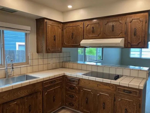 a kitchen with a sink and cabinets