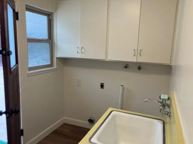a bathroom with a sink and cabinets