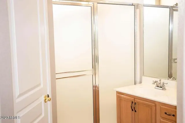 a view of a bathroom from a hallway