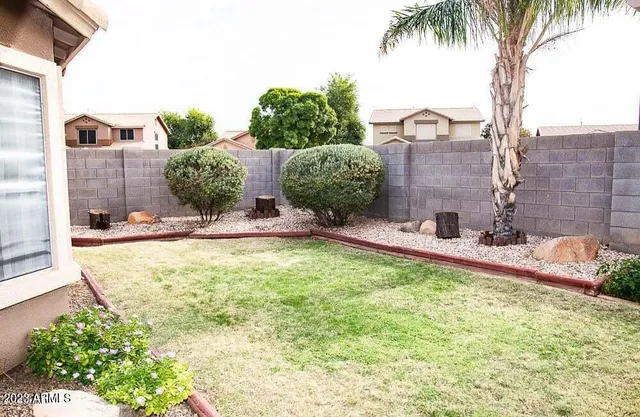 a bathroom with a refrigerator and a wooden floor