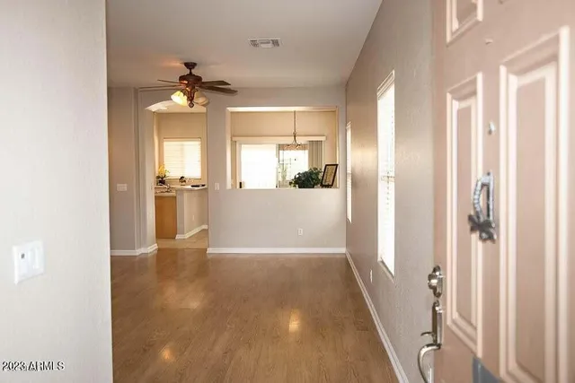 a view of a kitchen from the hallway