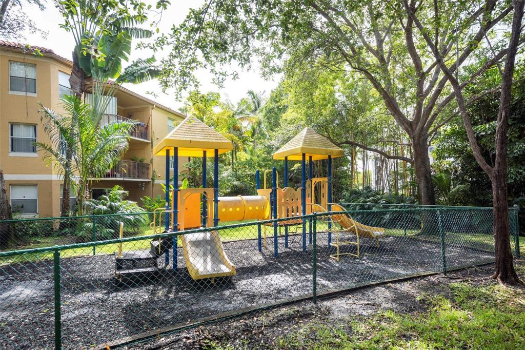 741 North Pine Island Road, Unit 303 Plantation, FL 33324 - Photo 27 of 32 a view of backyard with green space