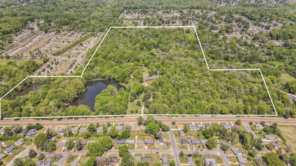 530 West Raines Road Memphis, TN 38109 - Photo 5 of 38 Expansive wooded acreage featuring a large private pond, mature tree canopy, and substantial undeveloped land