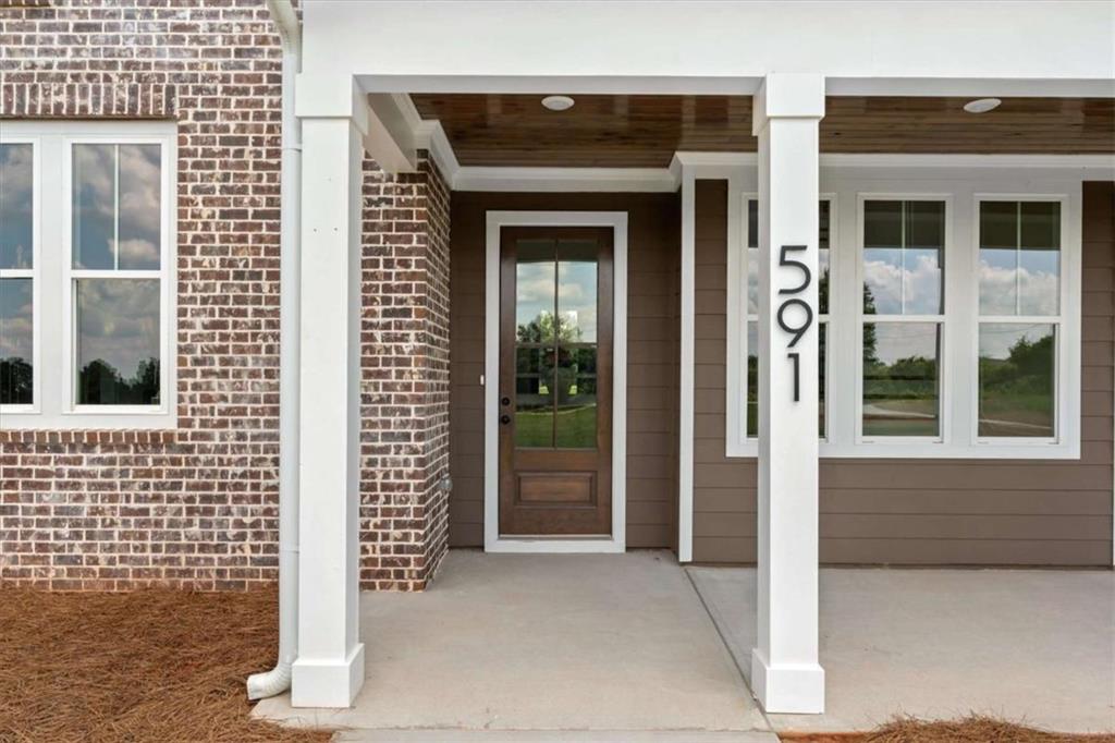 591 Welcome Road Roopville, GA 30170 - Photo 8 of 60 a front view of a house with a porch