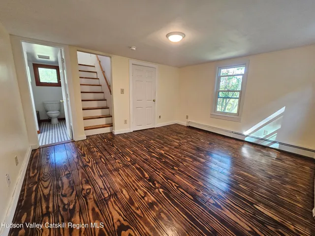 a view of a grassy field with trees