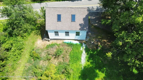 an aerial view of house with yard