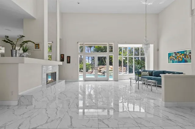 a spacious bedroom with a bed and a night stand