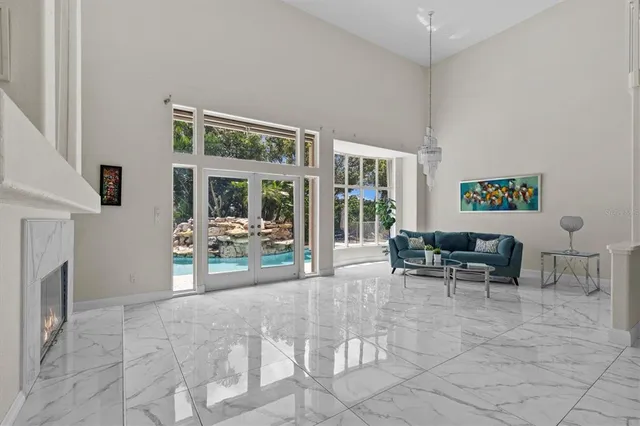a spacious bathroom with a granite countertop sink a toilet and a mirror
