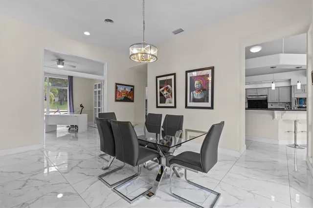 a kitchen with a sink window and cabinets