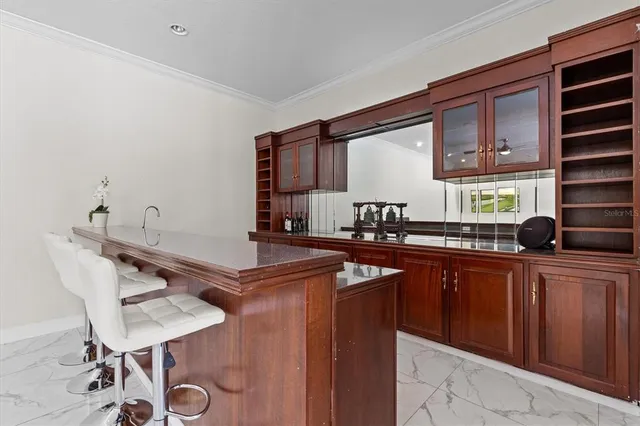 an aerial view of a house with garden space and lake view