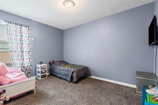 a bedroom with a bed and a closet