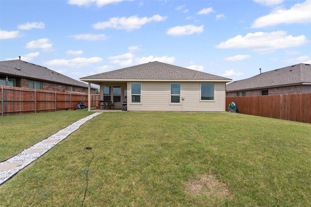 1104 Dublin Drive Cleburne, TX 76033 - Photo 27 of 39 Back of house featuring a sunroom, a fenced backyard, and roof with shingles