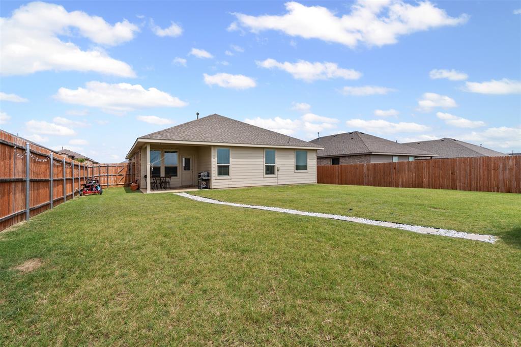 1104 Dublin Drive Cleburne, TX 76033 - Photo 30 of 39 Back of house with a fenced backyard, a patio area, and a shingled roof