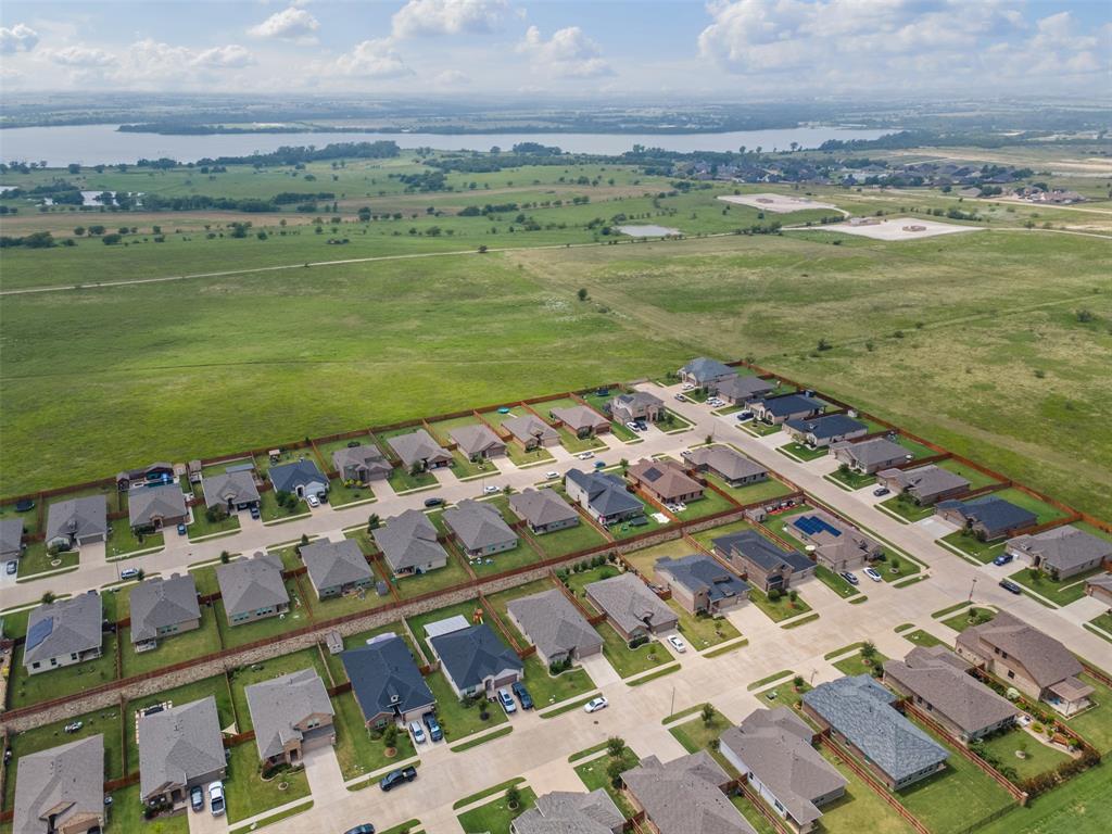 1104 Dublin Drive Cleburne, TX 76033 - Photo 34 of 39 Aerial perspective of suburban area featuring a nearby body of water