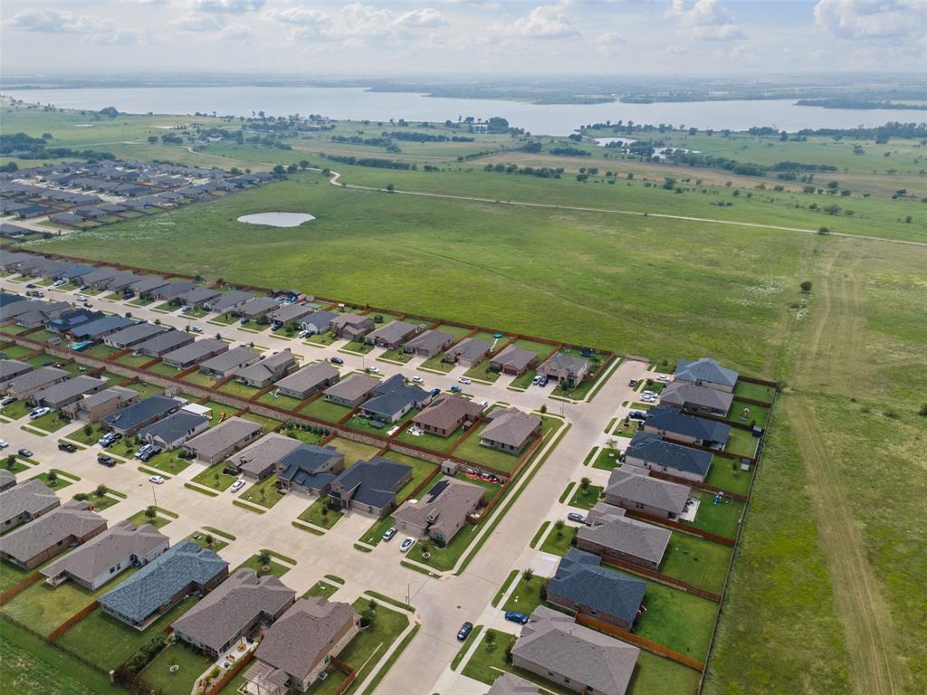1104 Dublin Drive Cleburne, TX 76033 - Photo 35 of 39 Aerial view of property and surrounding area featuring a nearby body of water and nearby suburban area