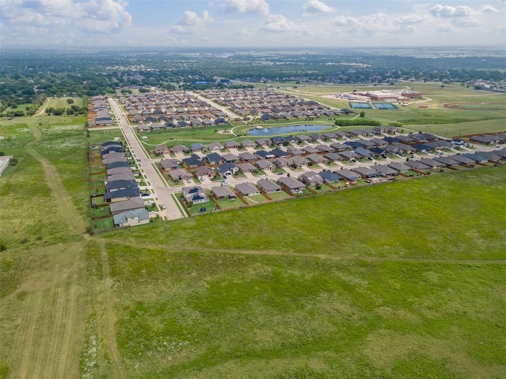 1104 Dublin Drive Cleburne, TX 76033 - Photo 36 of 39 Aerial view of property's location featuring a large body of water and nearby suburban area