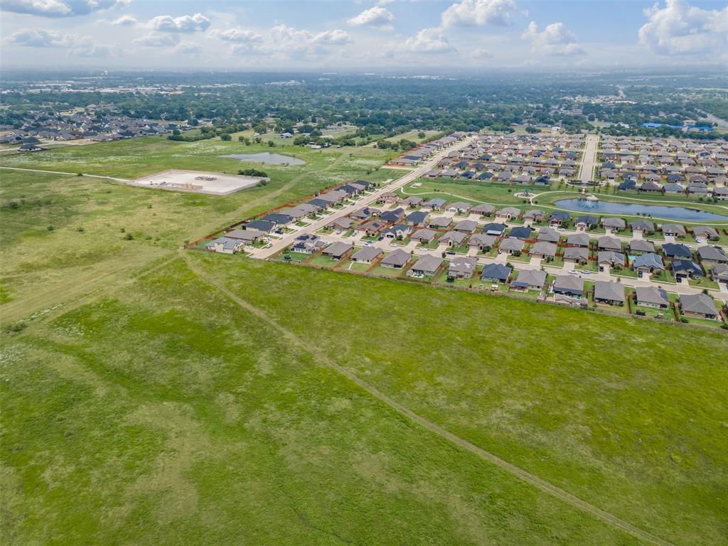1104 Dublin Drive Cleburne, TX 76033 - Photo 37 of 39 Aerial perspective of suburban area featuring a nearby body of water