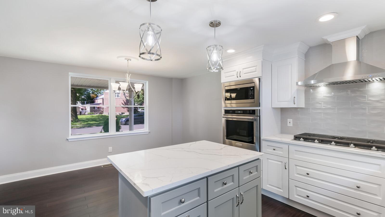 509 Scenic Road Springfield, PA 19064 - Photo 15 of 31 Beautiful gray island with quartz counter