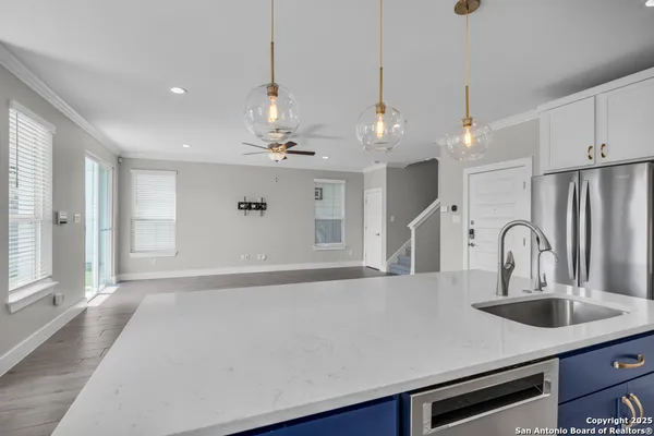 a stove top oven sitting inside of a kitchen