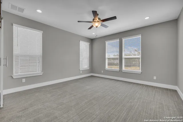 a bathroom with a shower sink and mirror