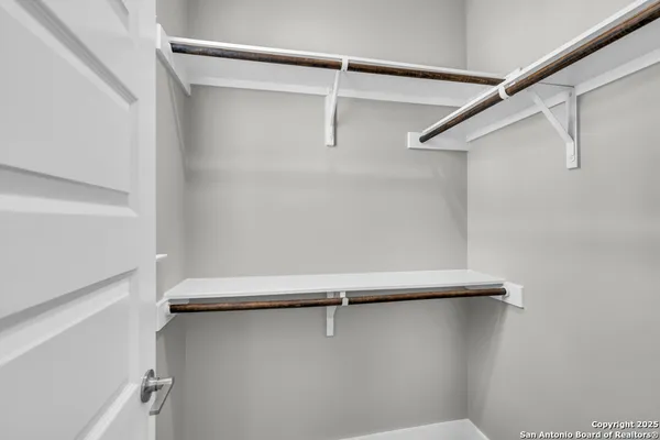 a view of a house with backyard and porch