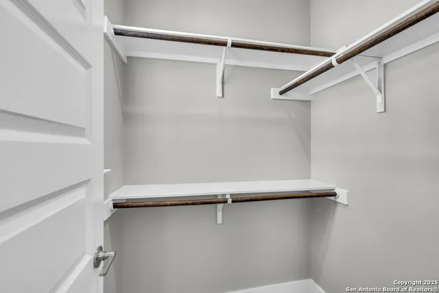 a view of a house with backyard and porch