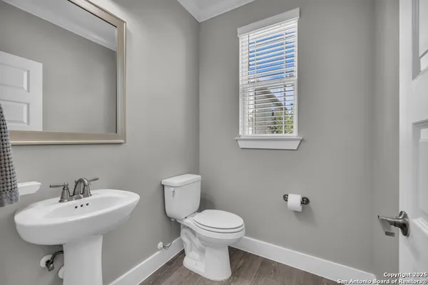 a view of kitchen and hall with wooden floor